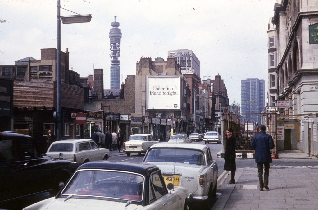 View of the BT Tower above a street in the 1970s.